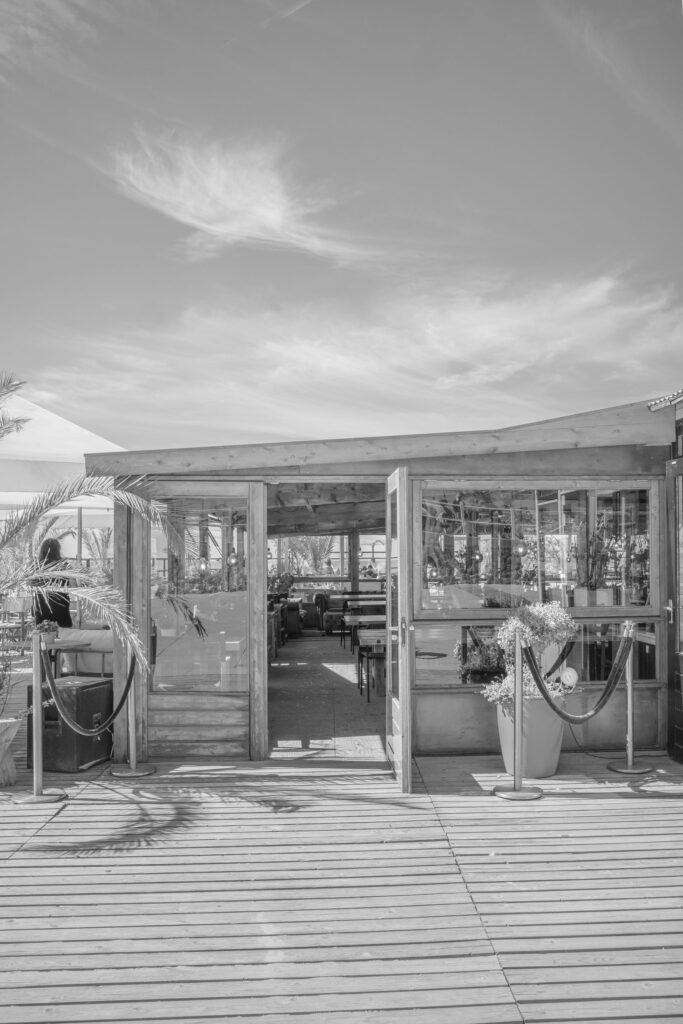 Beach bar structure along shoreline near Middenboulevard Scheveningen