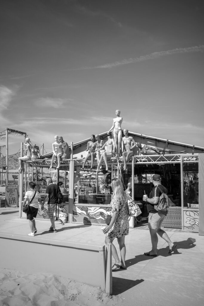 Decorative dolls displayed inside Pizza Club Destination for Fun Food and Party Scheveningen