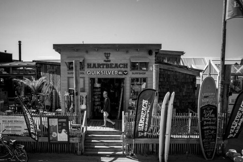 Surfboards and signage outside Hart Beach surfshop and surfschool Strandweg Scheveningen