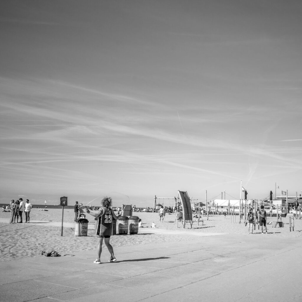 Person jumping on beach near Strandweg Visserhavenweg Scheveningen